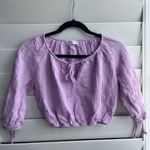 Purple women’s vestique top size small, sleeves end at elbows